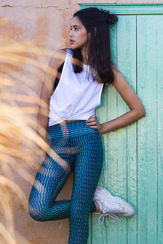 pure by luce Alou Akchour leggings: blue printed leggings inspired by Morocco in collaboration with Hasna Lahmini and the Rehanna white sports top with cut-out sleeves