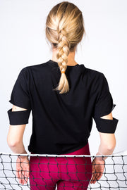 pure by luce sustainable Yattou Black sports T-shirt with cut-out sleeves and dark red unicolour Noor Ruby leggings with booty contouring