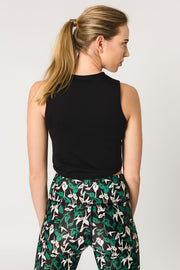 pure by luce sustainable Gugu Black sports crop top with the green all-over printed Naomi Joburg leggings