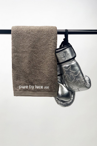 pure by luce sustainable grey Sports towel 50x100cm made from GOTS-cerified organic cotton with a pair of silver boxing gloves