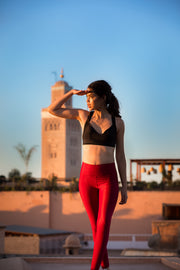 pure by luce sustainable dark red unicolour Noor Ruby leggings with booty contouring with the Charo Black sports bra top